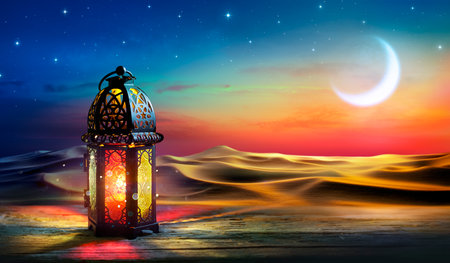 Ramadan Kareem - Arabic Lantern At Dawn In Desert With Crescent Moon In Starry Sky - Abstract Glitter In The Candlelightの写真素材