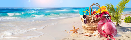 Beach Vacation - Bag And Accessories On Tropical Sand With Defocused Ocean - Summer Holidayの写真素材