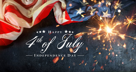 Independence Day Card - 4th July - USA Flag With Sparkler On Black Rock And Abstract Bokeh Lightsの写真素材