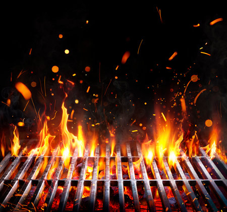 Barbecue Grill - Embers With Flames And Abstract Sparks - Grid And Fire On Charcoal In Black Backgroundの写真素材