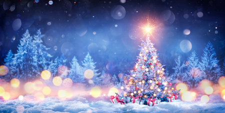 Christmas Tree On Snow In Night Forest With Shiny Star And Gift Boxes In Winter Landscape And Abstract Bokeh Lightsの写真素材