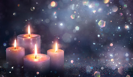Advent Candles - Four Purple Candlelights Glowing In Shiny Dark Background With Glittering And Abstract Lightsの写真素材