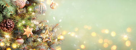 Christmas Ornaments On Tree - Lights Glowing In Fir Branches With Pine Cone And Green Abstract Backgroundの写真素材