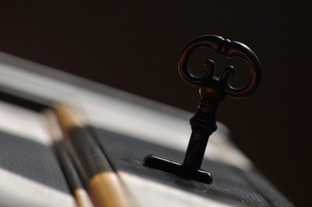 Open door with keys, key in keyholeの写真素材