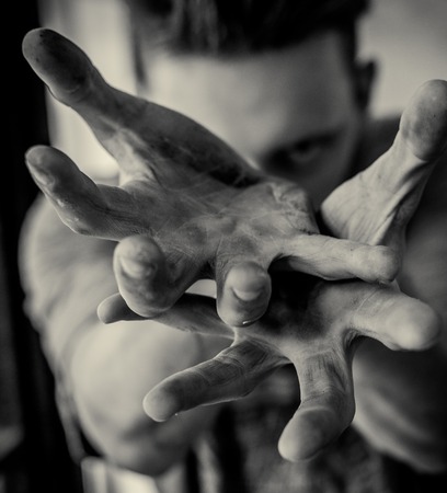 Terrible zombie dirty hands of the mummy, Halloween theme, black background, isolated, hand of death with fingernails, monstrous artの写真素材