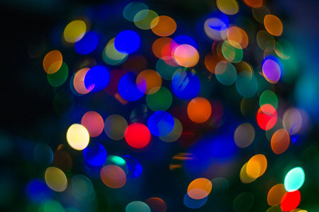 Abstract blue and colorfull bokeh texture on black backgroundの写真素材