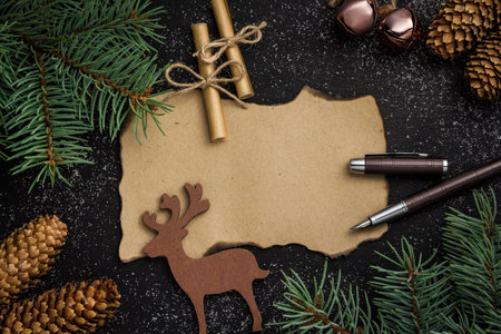 Spruce branches on a dark vintage wooden background. christmas conceptの写真素材