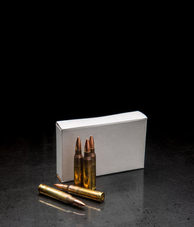 Bullet isolated on black background with reflexion. Rifle bullets close-up on black back. Cartridges for rifle and carbine on a black.の写真素材