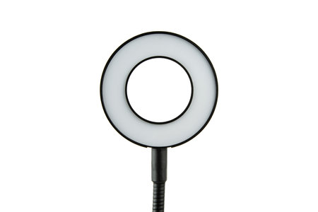 Closeup of circular neon LED lamp isolated white background. Popular modern light for make-up and...