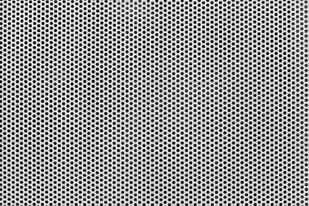Background of wavy metallic grid with holes. Metal mesh as background. Perforated metal back.の写真素材