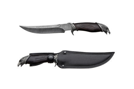 Damascus steel hunting knife. Decorative handle made of wood and metal in the form of an eagle's head. leather case. Isolate on a white background.の写真素材