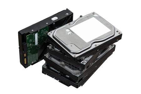 Hard drives stacked on top of each other. SATA 3.5 HDD for information storage. Isolate on a white background.の写真素材