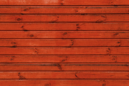 Red wooden background. Rough boards. Natural wood texture and pattern.の写真素材