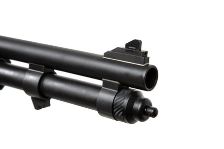 Pump-action 12 gauge shotgun isolated on a white background. Additional handle. A smooth-bore weapon with a plastc stock.の写真素材