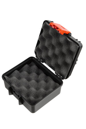 Black plastic container with foam inside for safe storage and transportation of fragile and expensive items. Sturdy plastic case. Isolate on a white background.の写真素材