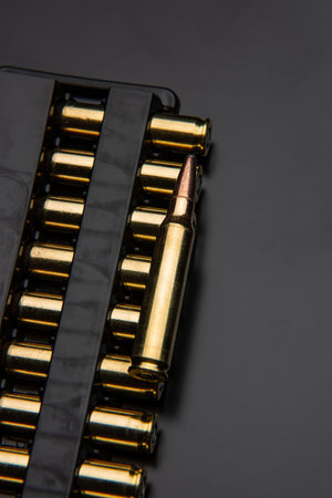 Bullet isolated on black background with reflexion. Rifle bullets close-up on black back. Cartridges for rifle and carbine on a black.の写真素材