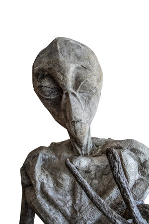 Alien sculpture with a humanoid shape, detailed texture, large head, deep-set eyes, gray stone-like...