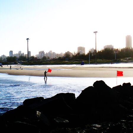 Prohibited to bathe in the sea, red flag.の写真素材