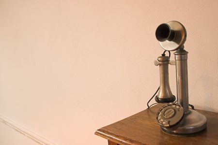 Old phone in a desk,  with sepia tintiの写真素材