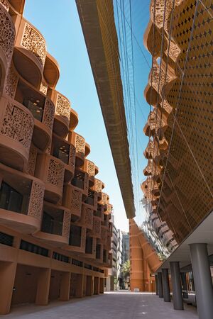 Abu Dhabi, United Arab Emirates - Jun., 2018: Hotels of Masdar City with terracotta walls decorated with arabesque patternsのeditorial素材