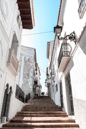 Traditional Mediterranean white street in the old town of Altea, Costa Blanca Coast, province of Alicante, Valencian Community, Spain, Apr.2019の写真素材