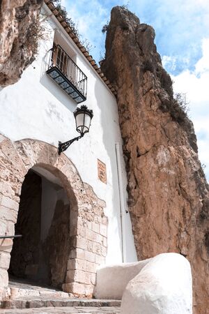 The main entrance to the ancient castle - Castell de Guadalest, Guadalest, province of Alicante,...