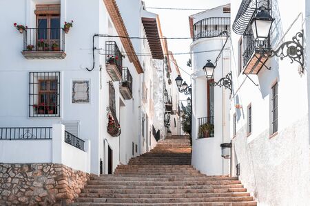 Street of a snow-white southern town on the hills, Costa Blanca Coast, province of Alicante, Spain,...