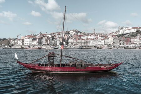 Wine barrels in a local traditional boat on the Douro River, Portugal, Nov.2019の写真素材
