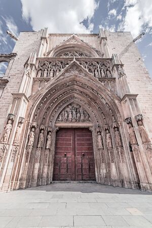 Arched entrance with sculptures and bas-reliefs to the Gothic temple, Valencia, Spain, Apr. 2019の写真素材