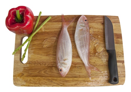 Fresh red with tomato,knife and parsley  over wooden chopping board isolet