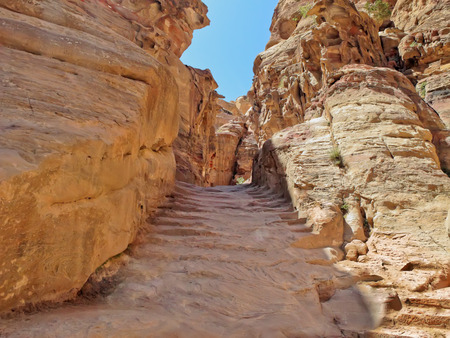 The old stone stairs leading up to the monastery Al Dayr. Petra, Jordan. Petra - Nabataeans capital city (Al Khazneh). Made by digging a holes in the rocks. Roman Empire period.の写真素材