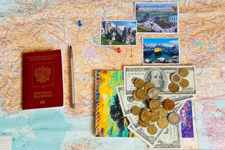 Preparations for the journey to Turkey.Russian international passport with money, notebook and...