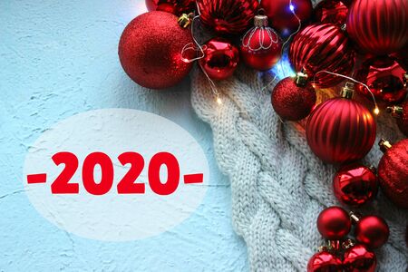 2020. Red Christmas background, bunch of balls for Christmas tree close up,
