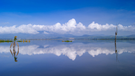 CLOUDS REFLECTED ON A MIRROR LAKEの写真素材
