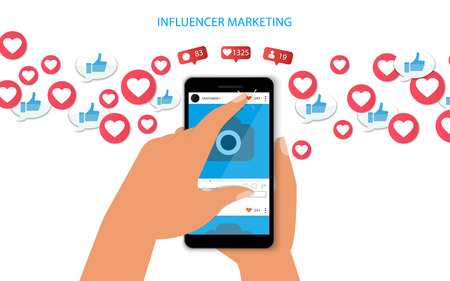 Influencer marketing concept with hand holding smartphone and like and hearts Illustration.のイラスト素材