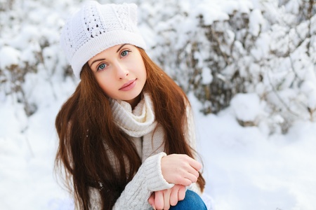 Young girl posing in winter forest の写真素材
