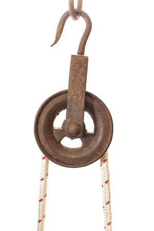 A concept suggesting the strengthening of proven methods through modernization. An old pulley is used with a modern nylon reinforced rope providing added strength and comfort.の写真素材