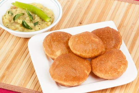 Delicious deep fried poori  puri  served with spicy potato onion curry  saagu  の写真素材