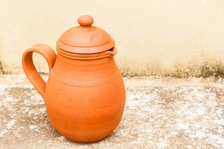 An earthenware water jug used to keep water cool in summer の写真素材