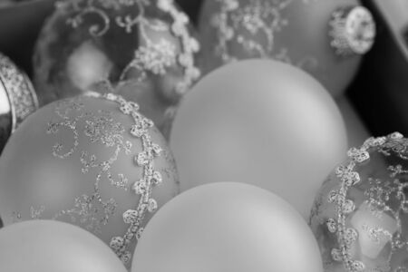Old Christmas ornaments in a box - Vintage Christmas ornaments in a Black and white image. Shallow Depth of field used for background.の写真素材