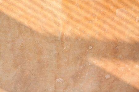 Shadows on cement floor background - Shadows of window bars on a old cement plastered floor forming a pattern of lines.の写真素材