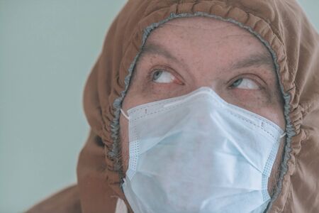 A man in a medical mask. A portrait of a man in a protective mask from coronavirus.の写真素材