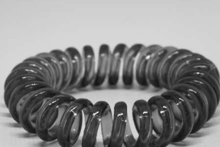Elastic band for hair on a white background close-up. Macrophotography.
