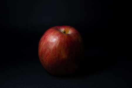 Red apple isolated on blackの写真素材