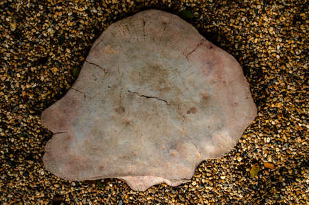 The big stone is surrounded by smaller stones background