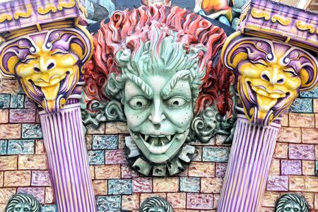 Acireale (CT), Italy - February 28, 2017: detail of a allegorical float, depicting a face of a devil woman with the sides two columns, during the carnival parade along the streets of Acireale.のeditorial素材