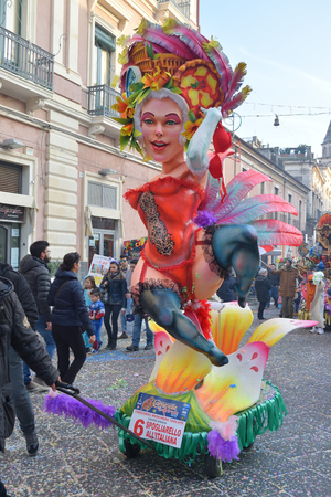 Acireale (CT), Italy - February 28, 2017: small allegorical float, depicting a burlesque dancer, during the carnival parade along the streets of Acireale.のeditorial素材