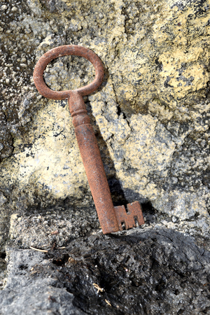 very old door key in rusty ironの写真素材