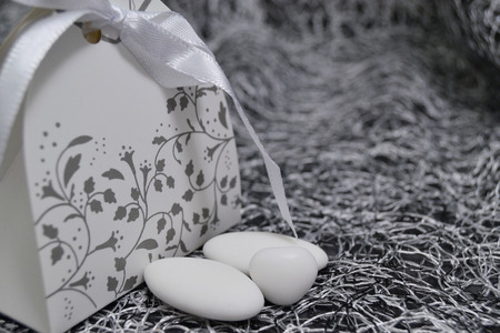 wedding dress shaped box with almond confetti insideの写真素材
