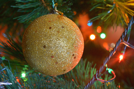 christmas balls on tree with lights and starsの写真素材